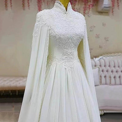 Lace Slim Long Sleeve Fishtail Wedding Dress In Ivory with delicate crochet bodice, fitted waist and flowing fishtail skirt for classic ceremonies