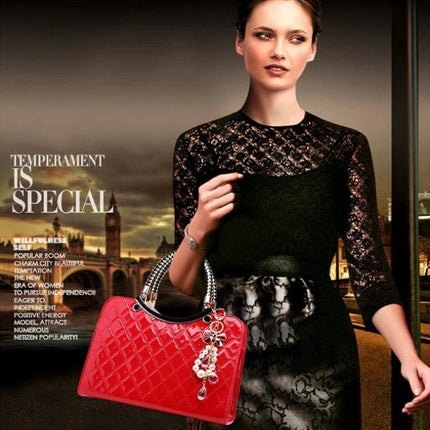 Large Capacity PU Leather Handbag For Everyday Use modeled by a woman holding a red quilted bag with decorative charm, multiple compartments visible