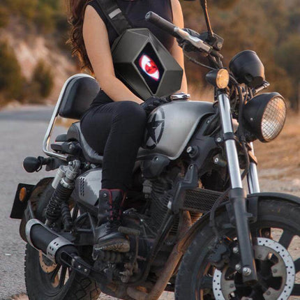 LED Illuminated Motorcycle Shoulder Bag For Outdoor Use Water Repellent shown on rider with LED display active on a motorcycle commute