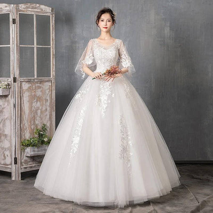 Long Sleeve Wedding Dress With Train For Your Wedding Day model in lace bodice, sheer long sleeves and full tulle skirt for ceremony and portraits