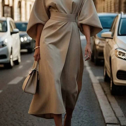Loose Batwing Sleeve Belted Dress For Everyday Casual Wear model walking on city street in beige with detachable waist belt and wide batwing sleeves