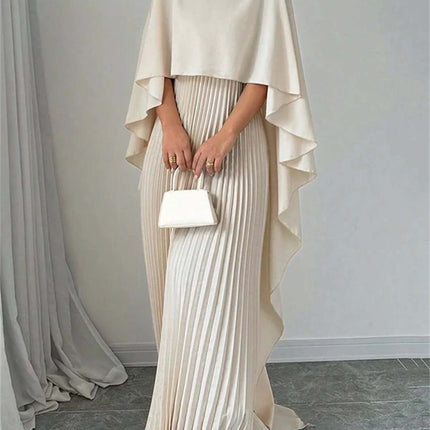 Loose Batwing Sleeve Dress For Everyday Commute S-XXL model wearing milky white pleated floor-length dress with cape-style batwing sleeves and small white handbag