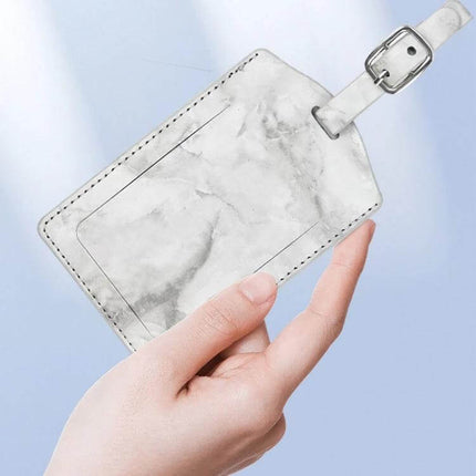 Marbled PU Leather Luggage Tag for Easy Travel Identification - white marble PU leather tag held in hand, stitched ID window, buckle strap (11×7cm, 16g)