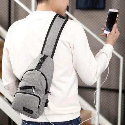 MeiJieLuo Simple Men Chest Bag For Everyday Lightweight Carry — gray Oxford fabric sling with external USB port shown charging phone
