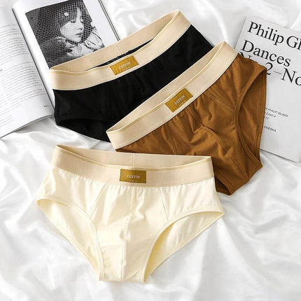 Men's Breathable Cotton Briefs Mid-Waist Everyday Comfort - three mid-waist breathable cotton briefs in black, brown, and cream shown on white background