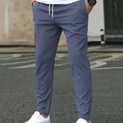 Casual Cropped Straight Pants For Leisure In Solid Black shown in navy on model with white sneakers, cropped above ankle for modern office-casual look