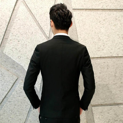 Men's Slim Fit Three-Piece Suit for Everyday Leisure worn by model seen from back in black jacket, waistcoat and trousers, tailored casual-ready look