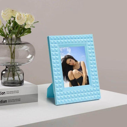 Mini 3 Inch Rivet Vertical Color Photo Frame For Polaroid Photos - compact blue ABS frame displaying Polaroid-style photo on desk