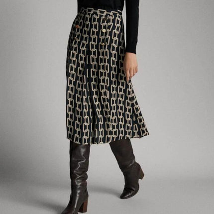 Spain Spot Print High Waist Skirt For Everyday Wear navy long A-line skirt with subtle spot pattern styled with tucked top and knee boots