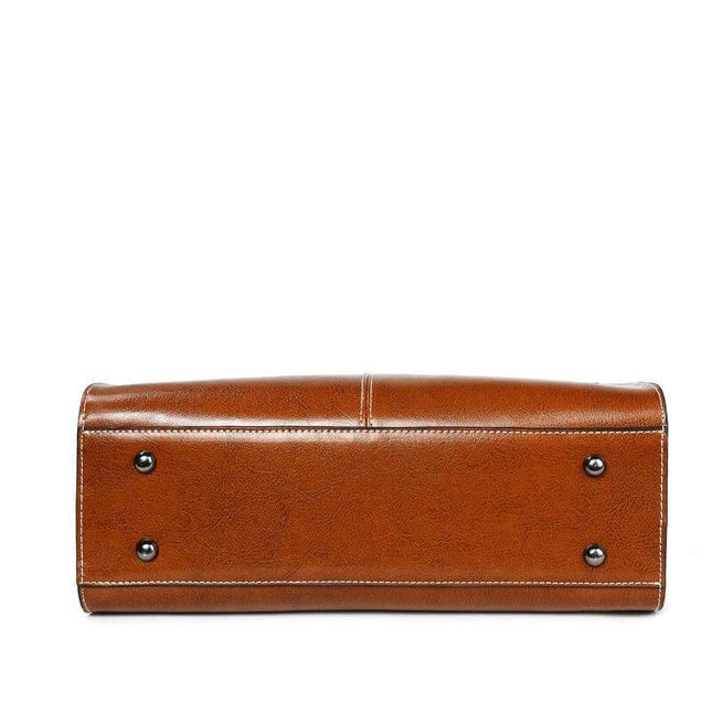 Oil Wax Leather Sling Handbag For Everyday Shoulder Use - brown oil-waxed cowhide bottom with metal feet, compact structured sling for daily essentials