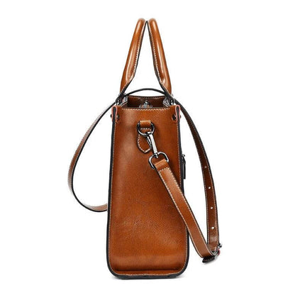 Oil Wax Leather Sling Handbag For Everyday Shoulder Use - brown oil-waxed cowhide compact sling with adjustable strap and structured side profile