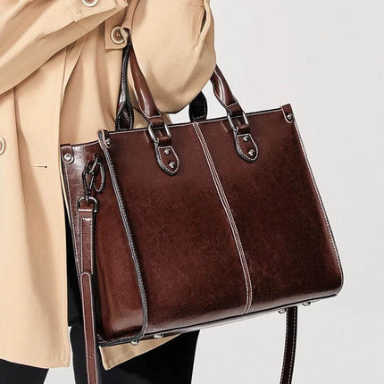 Oil Wax Leather Sling Handbag For Everyday Shoulder Use - brown oil-waxed cowhide compact sling with handles and adjustable shoulder strap