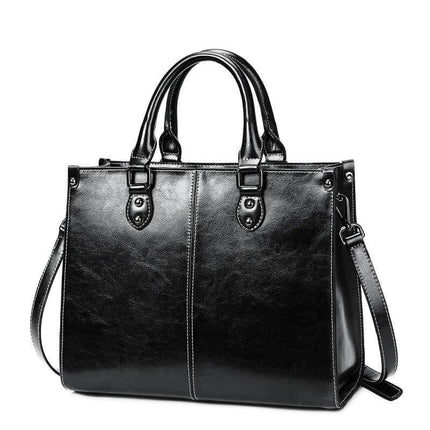 Oil Wax Leather Sling Handbag For Everyday Shoulder Use black oil-waxed cowhide sling with top handles and detachable shoulder strap