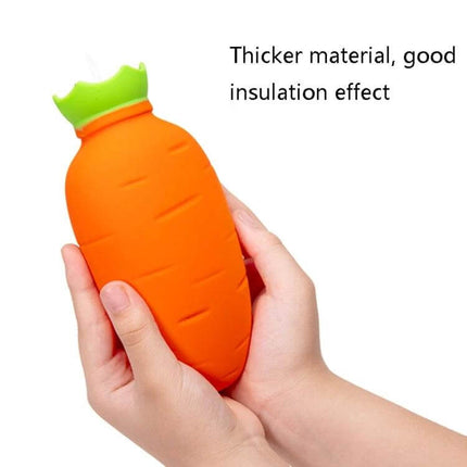 Orange Carrot-Shaped Silicone Water Bag Hand Warmer held in hands showing carrot design and green cap, 330ml portable hot or cold pack