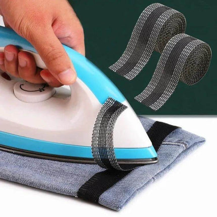 Pant Leg Stickers For Repairs 50m Polyester Roll For DIY Patches - iron-on tape roll being applied to pant hem with an iron for quick DIY mending