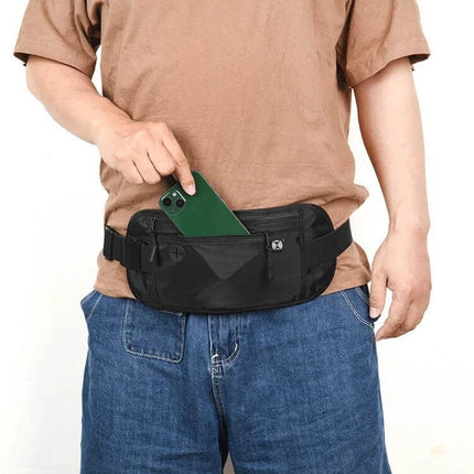 Passport Fit Waterproof Phone Waist Pack For Travel - black compact waist pack shown worn with phone being placed in front pocket, lightweight travel carry