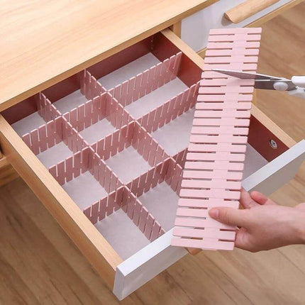Plastic Drawer Dividers, 4-Piece Pack, 37x7 cm For Drawer Organization – pink adjustable dividers being trimmed and arranged into grid compartments in a wooden drawer