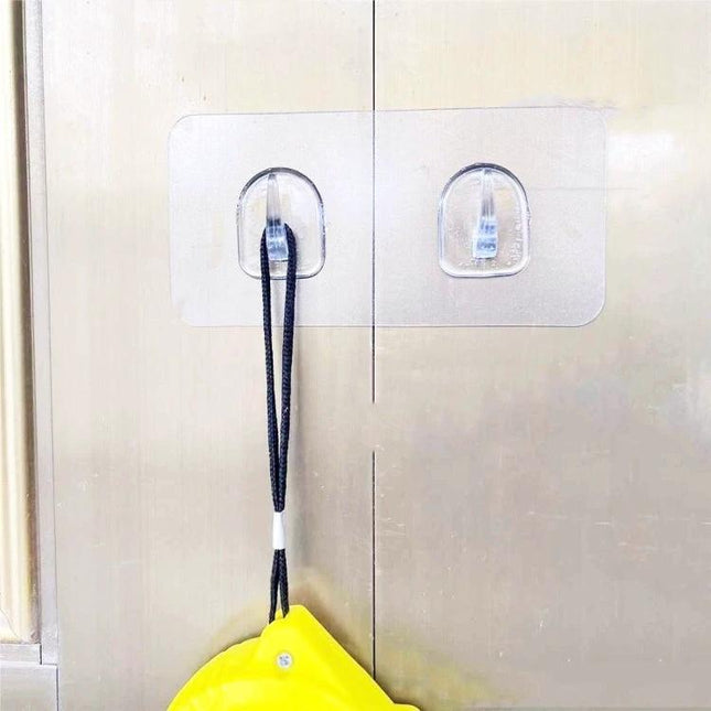 Plastic Sticky Double Hook For Paper Towels, No Drill Installation - clear stick-on double hook holding a yellow bag on smooth surface