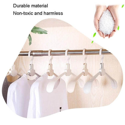 Plastic Travel Folding Clothes Hanger With Wide Shoulders hanging folded on closet rod, lightweight PP travel hanger for shirts and jackets
