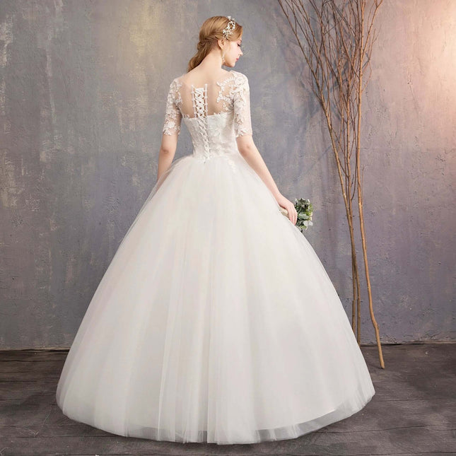 Plus Size Wedding Dress For Photo Studio Occasions - back view of puff skirt organza dress with deep V-back and lace sleeves ideal for bridal portraits