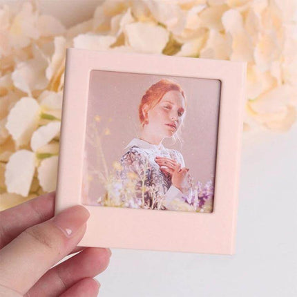 Polaroid Square Photo Frame Magnetic Building Blocks Fridge Magnet showing pink frame holding a square Polaroid photo against floral background