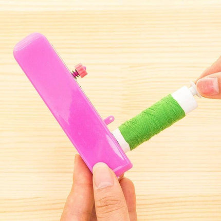 Portable Mini Handheld Sewing Machine 11x7 Cm For Quick Repairs – compact pink handheld sewing tool with green thread spool for on-the-go fixes