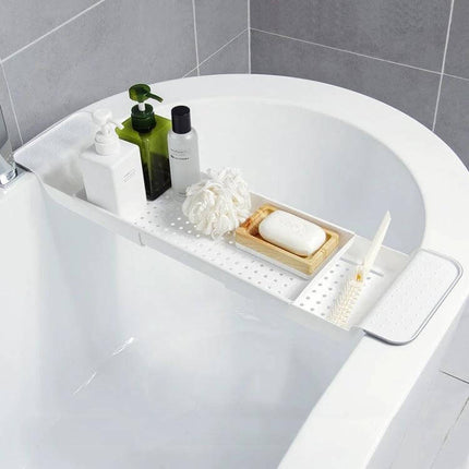 Retractable Bathtub Shelf Rack Adjustable White Gray holding soap, bottles and loofah across a bathtub with ventilated base