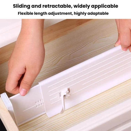 Retractable Drawer Storage Partition Board For Drawer Organization installed in a wooden drawer showing sliding retractable white divider