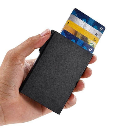 RFID Shielded Aluminum Card Holder For Everyday Use - slim black aluminum wallet held in hand showing multiple cards protruding