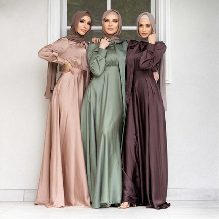 Three women in nude pink, mint green, and reddish brown satin gowns modeling Satin Dress With Lace Up Hem For Everyday Casual Wear in casual elegant styling