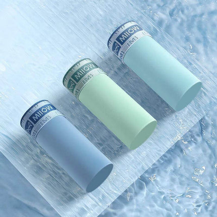 Seamless Ice Silk Men's Boxer Briefs For Everyday Comfort displayed in pastel blue, mint, and light teal tubes on icy surface