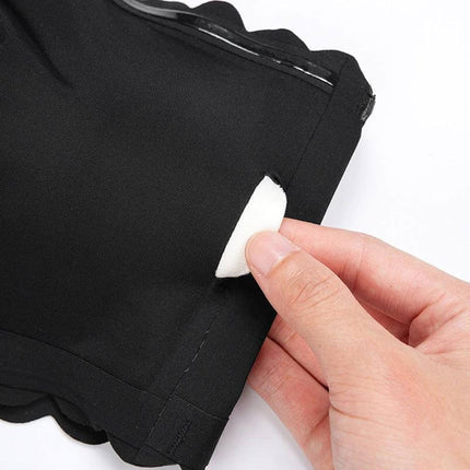 Seamless Tube Top Bra For Everyday Comfort All Day showing removable thin molded cup pad being inserted into black seamless tube top bra