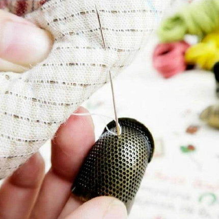 Sewing Thimble Finger Protector for Everyday Sewing Small copper thimble protecting fingertip while hand sewing with needle