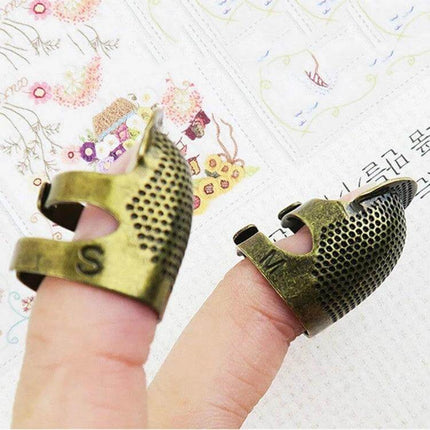 Sewing Thimble Finger Protector for Everyday Sewing Small copper fingertip protector on two fingers for quilting mending and precise hand stitching