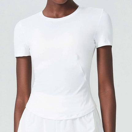 Alt Tag: Small Waist Yoga Top With Short Sleeves In Black For Studio Practice modeled in white studio lighting, short sleeves, fitted small-waist cut, quick-dry nylon