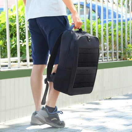 Solar Panel Backpack For Laptop With USB Charging Port carried by commuter showing solar panel and multiple compartments