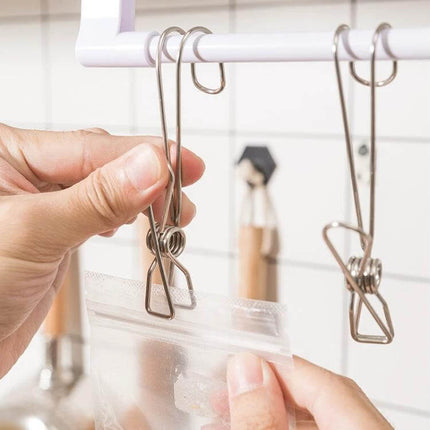 Stainless Steel Clothes Drying Clip 12-Pack For Towels hanging a plastic bag from a rack with rustproof stainless long‑tail clips, strong clamping force