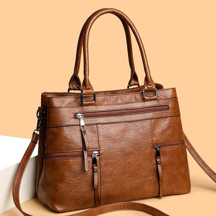 Textured PU Soft Commuter Shoulder Bag For Everyday in brown grained PU with multiple zipped pockets and adjustable strap for commuting