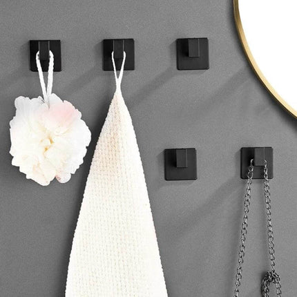 Thickened Solid Hooks No-Hole Wall Hanger For Towels And Clothes on gray wall holding towel, loofah and chain - black space aluminum no-drill hooks