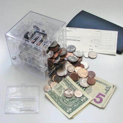 Transparent Money Maze Bank 3D Puzzle For Saving Coins clear PS cube showing coins and bills spilling out, maze bank teaching saving habits
