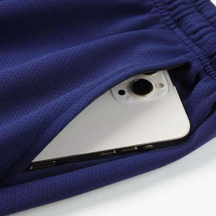 Unisex Multi Sport Running And Table Tennis Pants White - close-up of breathable pocket holding smartphone, elastic waistband and stretch polyester-spandex fabric