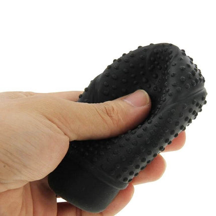 Universal Silicone Gear Shift Knob Cover Nonslip Grip textured black silicone cover being stretched by hand for secure non-slip driving grip