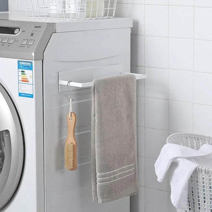 Wall Mounted Clothes Hanger Rack With Double Layer Storage mounted beside washing machine holding towel and brush, space-saving laundry room organizer