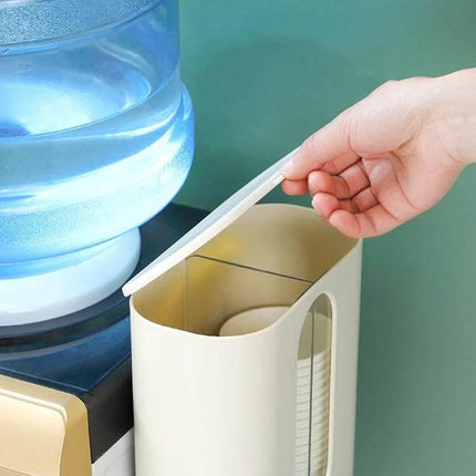 Wall Mounted Paper Cup Dispenser, Double Tube For Easy Cup Access white double-tube cup holder mounted beside water dispenser with hand lifting lid