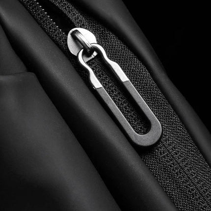 Weixier Waterproof Waist Bag Black For Everyday Use close-up of waterproof zipper pull and black oxford fabric texture