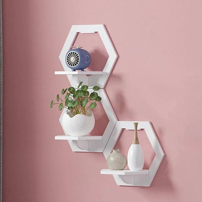 Wall Hanging Shelf For Flower Pot And Storage Square white hexagon wall-mounted shelves holding small plant and vases on pink wall