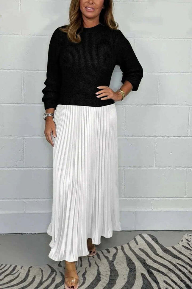 Women's Pleated Long Dress With Round Neck For Workwear modeled with black sweater, mid-waist pleated white skirt, long sleeves, office-appropriate look