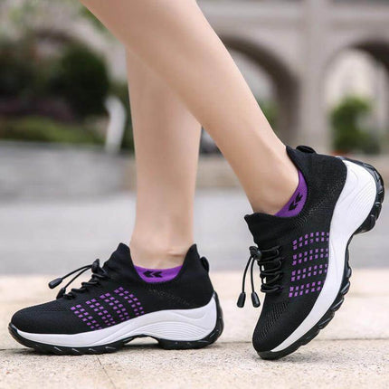 Womens Knit Slip On Casual Sneakers For Everyday Wear lightweight black knit slip-on sneaker with purple accents and cushioned white sole for commuting and errands