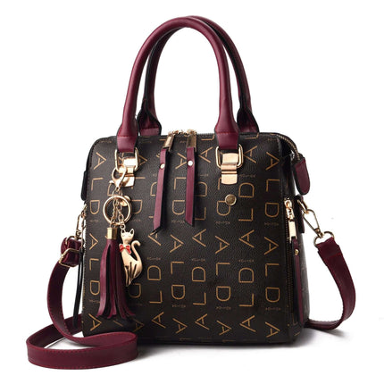 Women's PU Leather Tote Shoulder Bag Large Capacity in brown monogram with burgundy handles, structured vertical tote holding tablet and daily essentials
