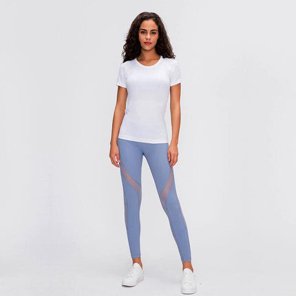 Womens Quick Dry Running Top Short Sleeve For Yoga modeled in white short-sleeve top with breathable fabric for yoga and running